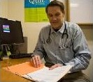 Dr. Brad Black at his desk at the CARD Clinic